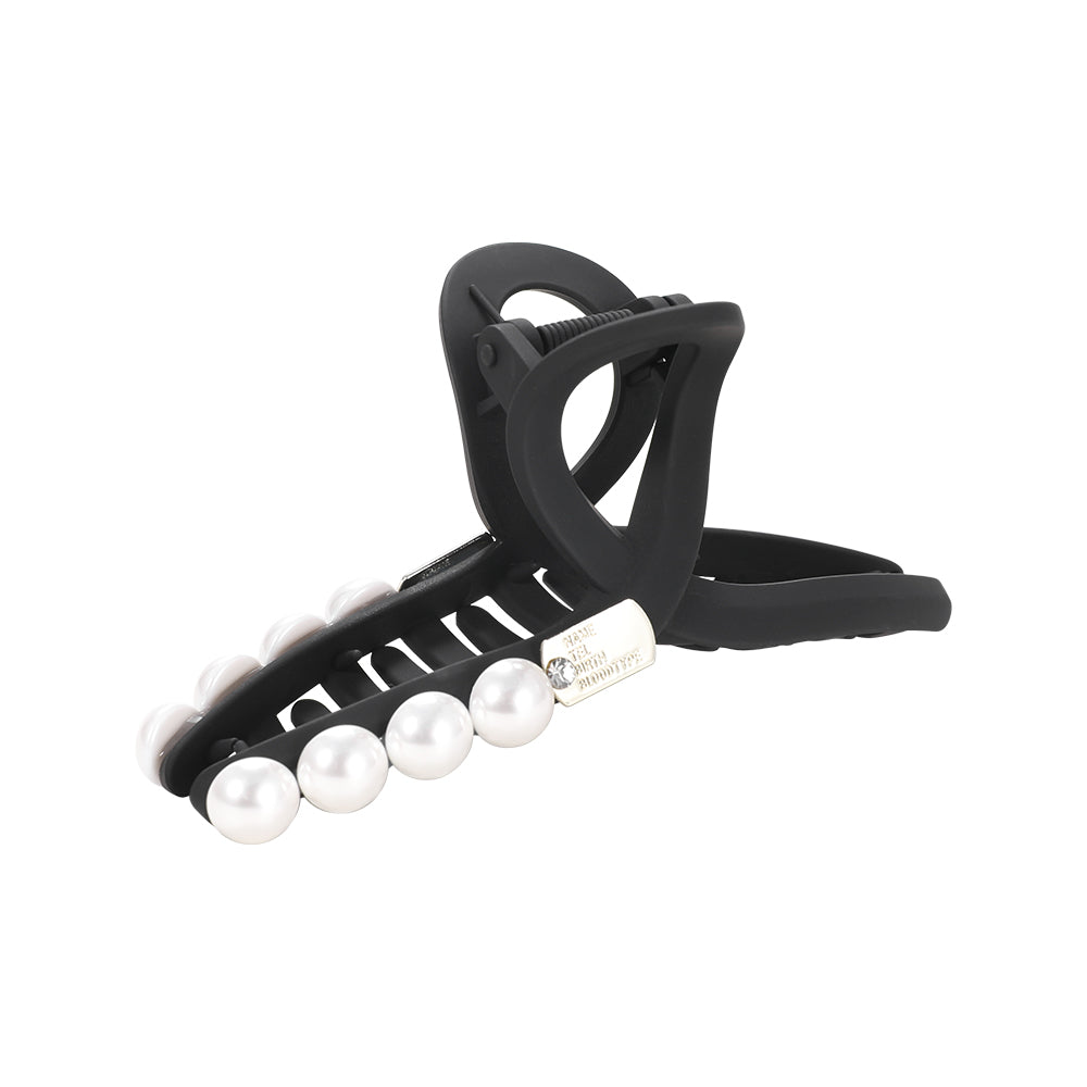 A sophisticated matte pearl hairpin with a high-end feel and a shark clip