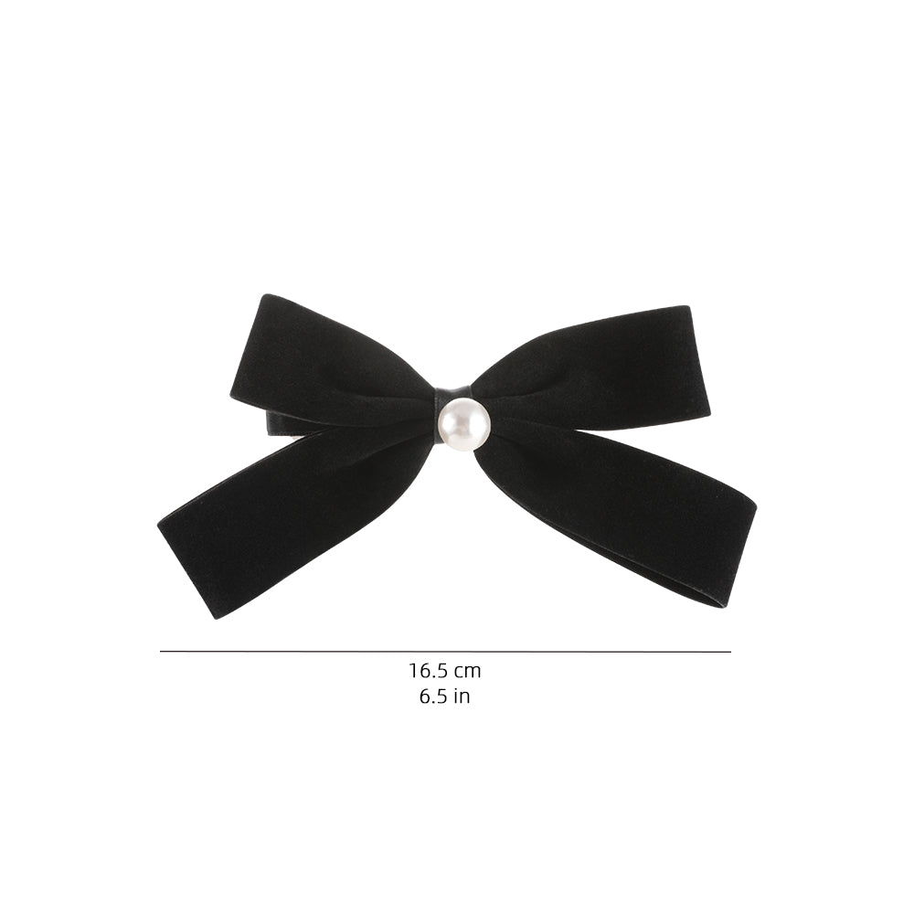 A French retro black velvet pearl bow with a hair clip at the back of the head