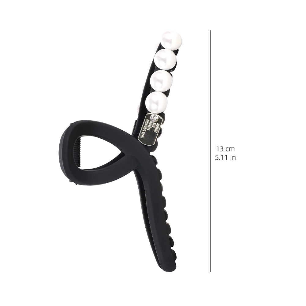 A sophisticated matte pearl hairpin with a high-end feel and a shark clip