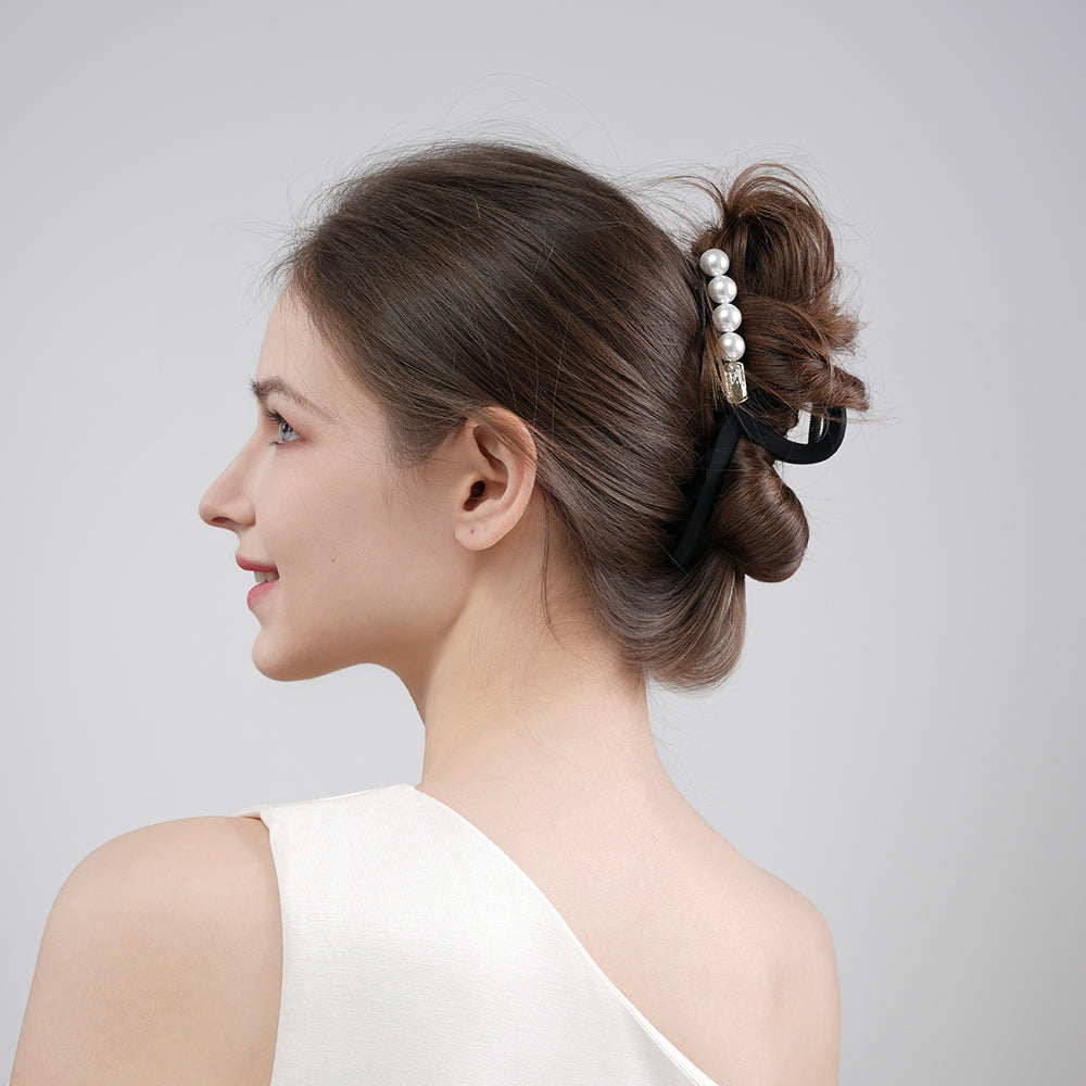 A sophisticated matte pearl hairpin with a high-end feel and a shark clip